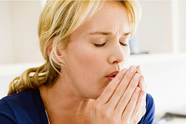 Close-up of a woman coughing --- Image by © Eric Audras/Onoky/Corbis